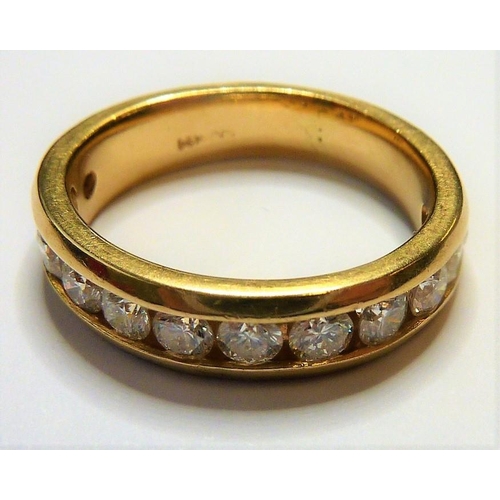 266 - A 14-carat gold half eternity ring set with twelve fine white diamonds; ring size  (The cost of UK p... 