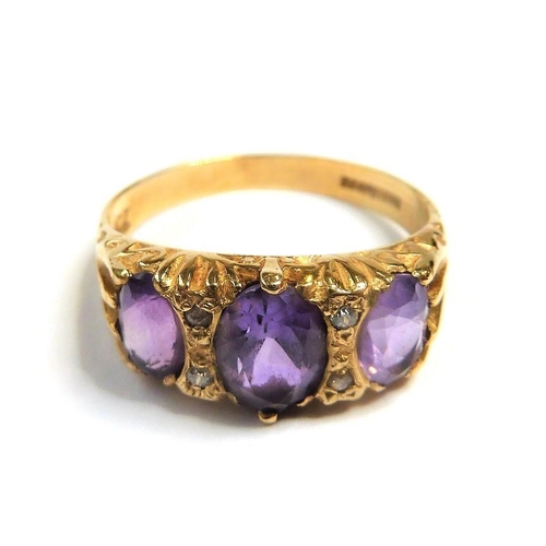 277 - A mid-Victorian 15-carat yellow-gold pink gemstone and half pearl ring; the three oval mixed cut sto... 