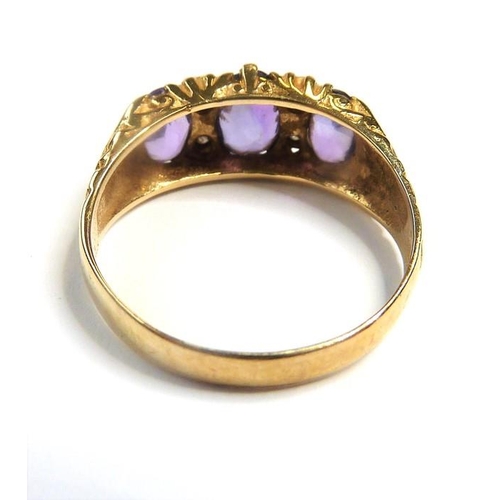 277 - A mid-Victorian 15-carat yellow-gold pink gemstone and half pearl ring; the three oval mixed cut sto... 