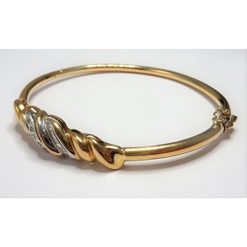 279 - A 9-carat gold and diamond bangle ring size ((total weight approx. 8.58g) (The cost of UK postage vi... 