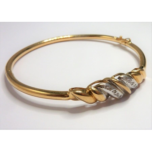 279 - A 9-carat gold and diamond bangle ring size ((total weight approx. 8.58g) (The cost of UK postage vi... 