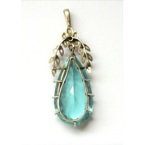 295 - An Edwardian aquamarine and diamond-set pendant; the pendeloque faceted aquamarine to the floral and... 