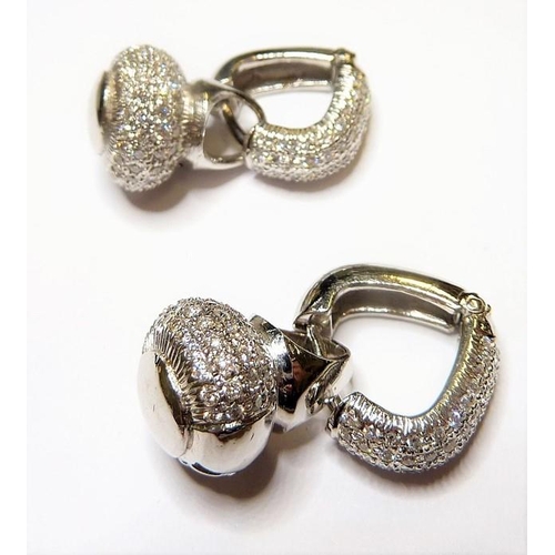 296 - A pair of 14-carat white-gold and diamond earrings fashioned as hoops together with detachable diamo... 