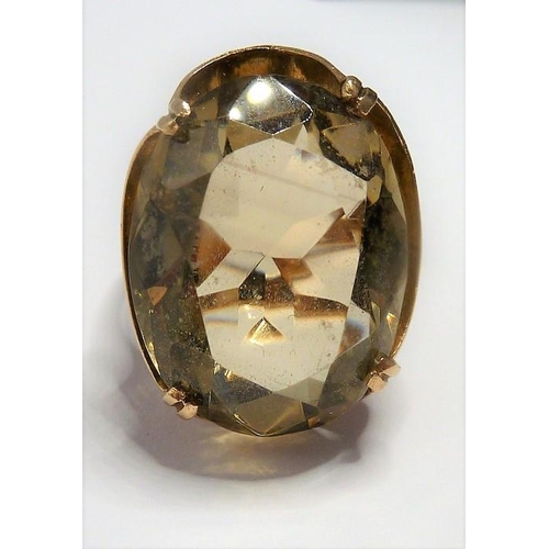 301 - A 9-carat gold ring set with a large citrine; ring size P (total weight approx. 7.4g)  (The cost of ... 