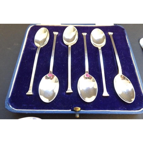 303 - A cased set of six hallmarked silver coffee spoons by Mappin & Webb Ltd together with a similar set ... 