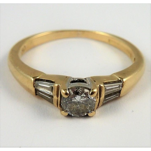 315 - An 18-carat gold solitaire diamond ring set with baguette diamond shoulders; ring size M (total weig... 