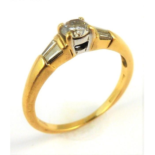 315 - An 18-carat gold solitaire diamond ring set with baguette diamond shoulders; ring size M (total weig... 