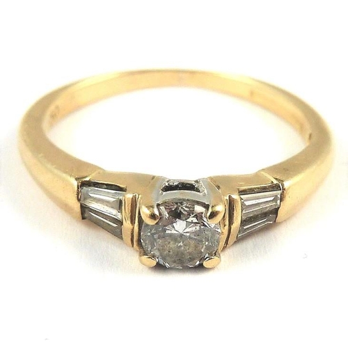 315 - An 18-carat gold solitaire diamond ring set with baguette diamond shoulders; ring size M (total weig... 