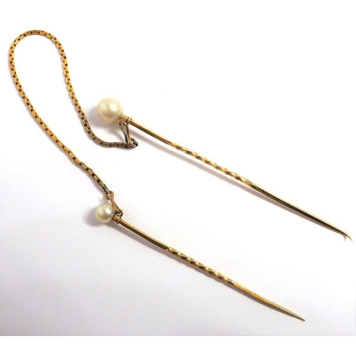 316 - A diamond-set and pearl (untested) stick pin, centrally set with an old brilliant-cut diamond with a... 