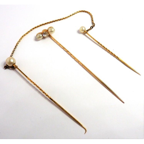 316 - A diamond-set and pearl (untested) stick pin, centrally set with an old brilliant-cut diamond with a... 