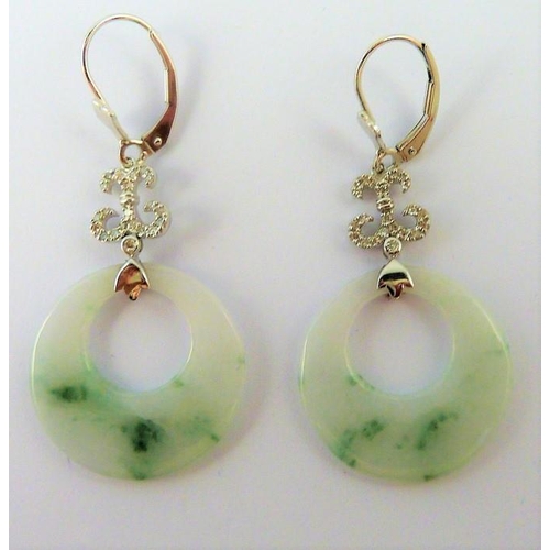 317 - A pair of white-gold and jade earrings (The cost of UK postage via Royal Mail Special Delivery for t... 