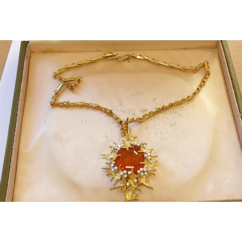 324 - A late 1960s/1970s fire opal and diamond brooch/pendant by George Weil, the central octagonal fire o... 