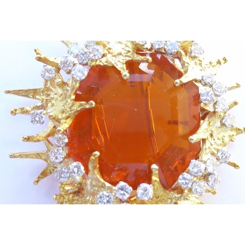 324 - A late 1960s/1970s fire opal and diamond brooch/pendant by George Weil, the central octagonal fire o... 