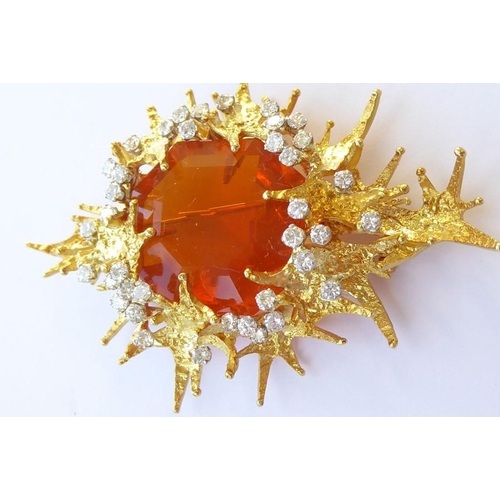 324 - A late 1960s/1970s fire opal and diamond brooch/pendant by George Weil, the central octagonal fire o... 