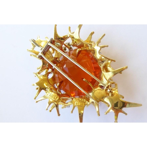 324 - A late 1960s/1970s fire opal and diamond brooch/pendant by George Weil, the central octagonal fire o... 