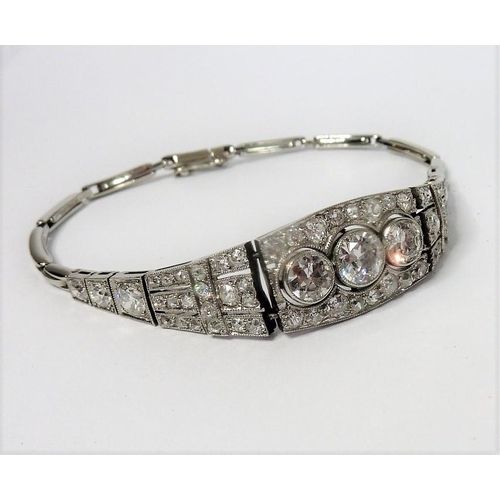 326 - A fine Art Deco platinum and diamond bracelet (The cost of UK postage via Royal Mail Special Deliver... 