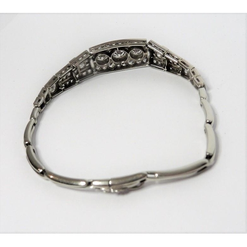 326 - A fine Art Deco platinum and diamond bracelet (The cost of UK postage via Royal Mail Special Deliver... 