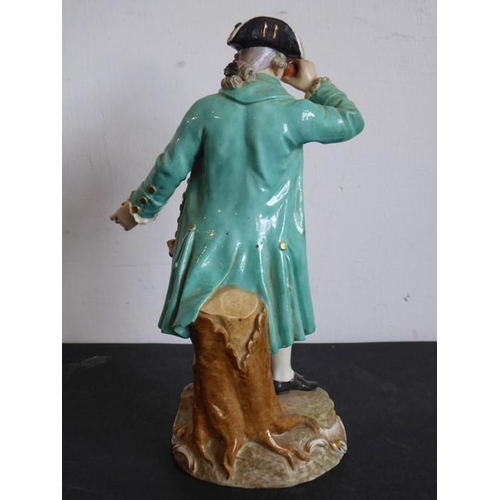 33 - A 19th century Meissen figure model; in 18th century-style dress with a long green coat and holding ... 