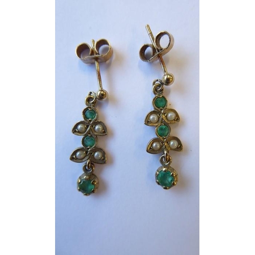 330 - A pair of emerald and half pearl ear pendants, each designed as two trefoils suspending a circular-c... 