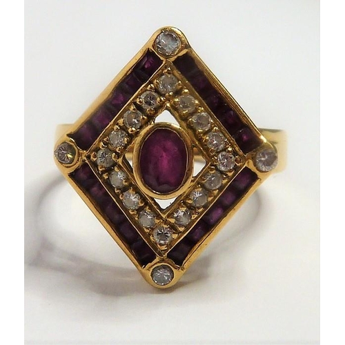 334 - A ruby and diamond-set 18-carat yellow-gold dress ring; the lozenge-shaped plaque centrally set with... 