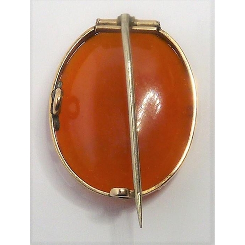 347 - An early 19th century hardstone cameo brooch; the oval carnelian depicting a winged Cupid to the yel... 