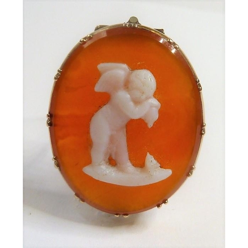 347 - An early 19th century hardstone cameo brooch; the oval carnelian depicting a winged Cupid to the yel... 