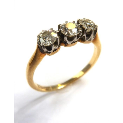 354 - A diamond three-stone ring, the old brilliant-cut diamonds set to the plain 18-carat yellow-gold sha... 