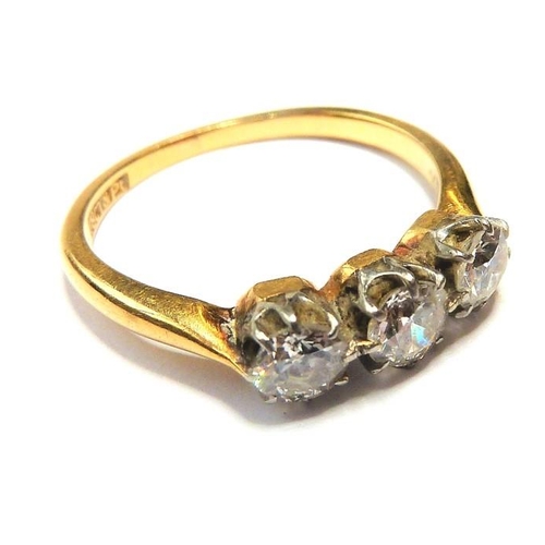 354 - A diamond three-stone ring, the old brilliant-cut diamonds set to the plain 18-carat yellow-gold sha... 