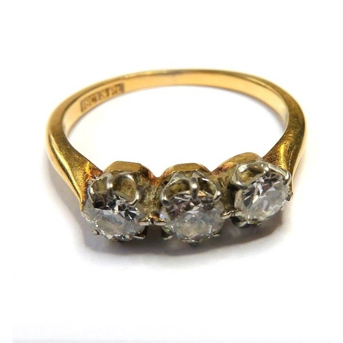 354 - A diamond three-stone ring, the old brilliant-cut diamonds set to the plain 18-carat yellow-gold sha... 