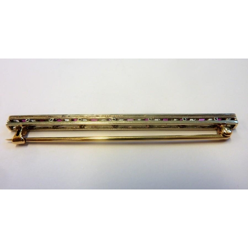 357 - A white and yellow-metal stick pin brooch set with white and pink stones in a horizontal line; the w... 