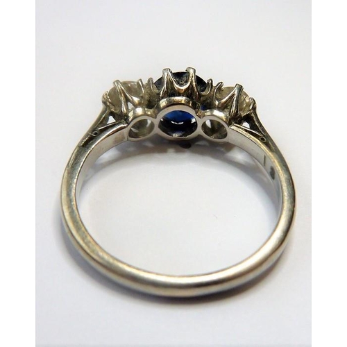 360 - A sapphire and diamond three-stone ring, the central circular mixed-cut sapphire with a brilliant-cu... 