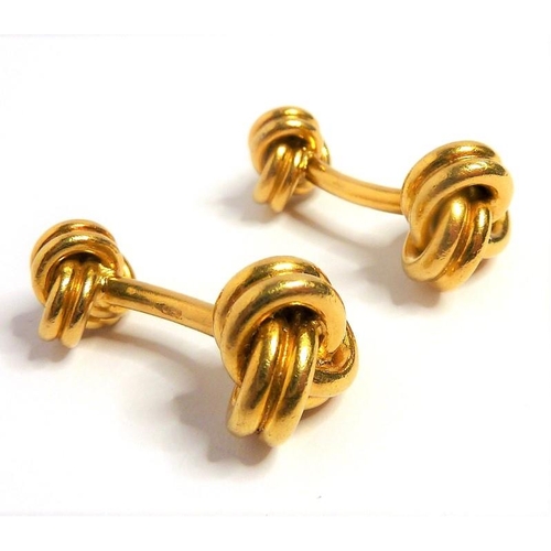 372 - A pair of double-knot cufflinks with rigid bar connections each stamped '750' (gross combined weight... 