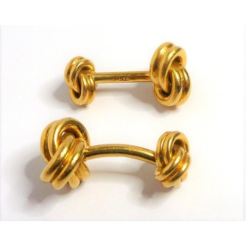 372 - A pair of double-knot cufflinks with rigid bar connections each stamped '750' (gross combined weight... 