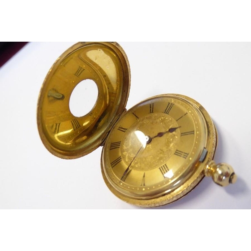 378 - A late 19th century lady's 18-carat gold (marked 18K) half hunter fob watch; the outer case with blu... 