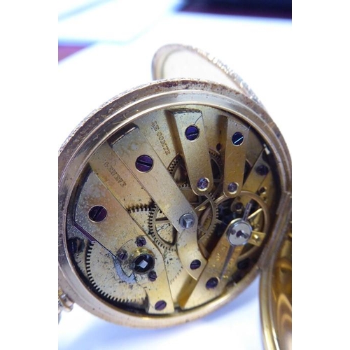 378 - A late 19th century lady's 18-carat gold (marked 18K) half hunter fob watch; the outer case with blu... 