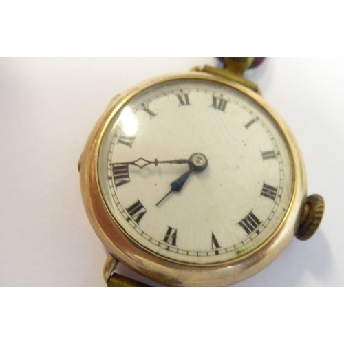 379 - A lady's early 20th century 9-carat gold cased wristwatch; cream-enamel dial with Roman numerals and... 