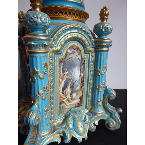 385 - A large 19th century Continental porcelain eight-day mantle clock of architectural form; the domed t... 