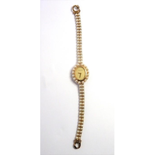 404 - A 9-carat yellow-gold and cultured-pearl wristwatch by Bueche Girod, the plain oval dial signed 'Bue... 