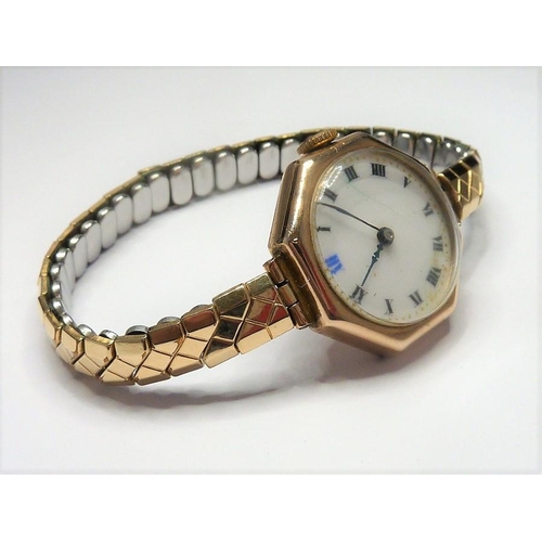 417 - A ladies octagonal shaped 9-carat gold wristwatch with white-enamel dial, in working order