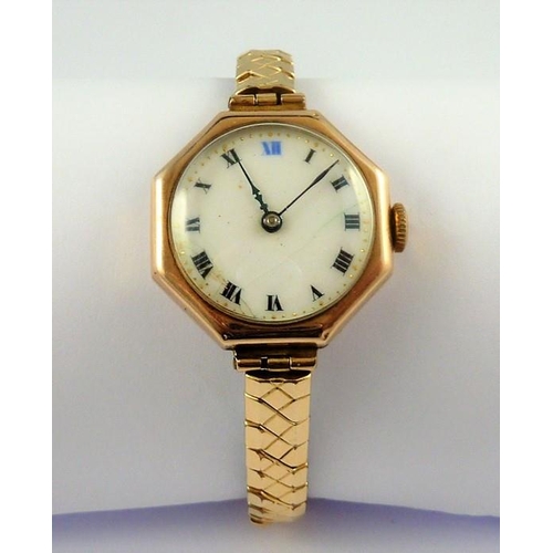 417 - A ladies octagonal shaped 9-carat gold wristwatch with white-enamel dial, in working order