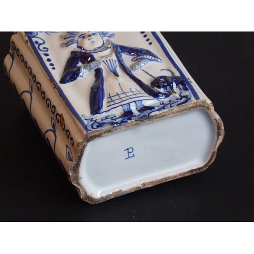 42 - A late 18th century tin-glazed earthenware tea caddy of primarily oval form; the two larger sides de... 