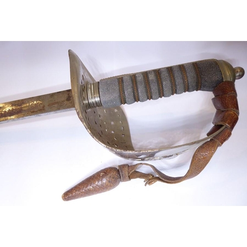 457 - An 1897 Pattern officer's sword with brown-leather regulation scabbard, complete with brown-leather ... 