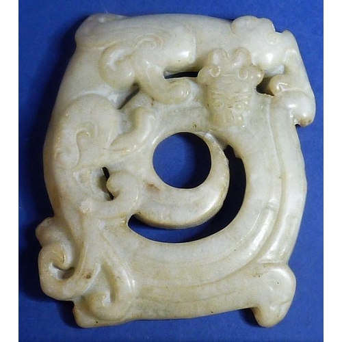 465 - An Asian hardstone Naga pendant, belt insert and two Sung, bead pendants (5)