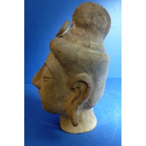 469 - A Tang pottery head of a Lokapala, an Asian terracotta head on a hardwood stand and a Chinese potter... 