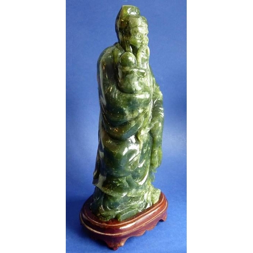 472 - A Feng Tian green jade god Fuxing (29cm high)