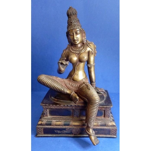 491 - A Tamil Nadu Southern India cast-bronze Parvathi figure in Bogashakti form, seated on a stepped lacq... 