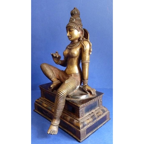 491 - A Tamil Nadu Southern India cast-bronze Parvathi figure in Bogashakti form, seated on a stepped lacq... 