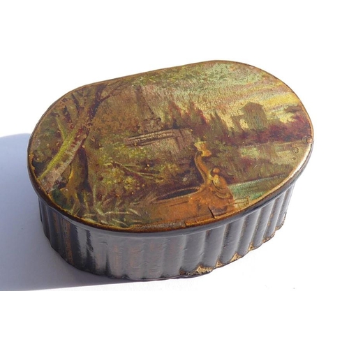 519 - A mid-19th century papier-mȃché snuff box of reeded oval form; the hinged lid depicting a country sc... 