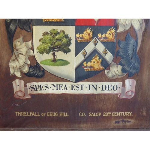 536 - A framed oak panel depicting the 'Threlfall of Grug Hill' (Co. Salop 20th century) coat of arms (fra... 