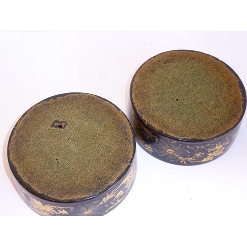 552 - A pair of early 19th century Regency period papier-mâché wine coasters; each decorated and gilded wi... 